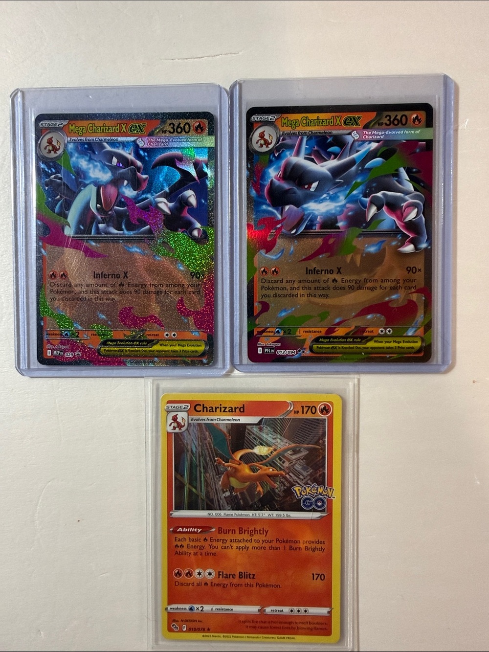 Pokemon Charizard Trio – Black, Orange & Blue Holo Cards